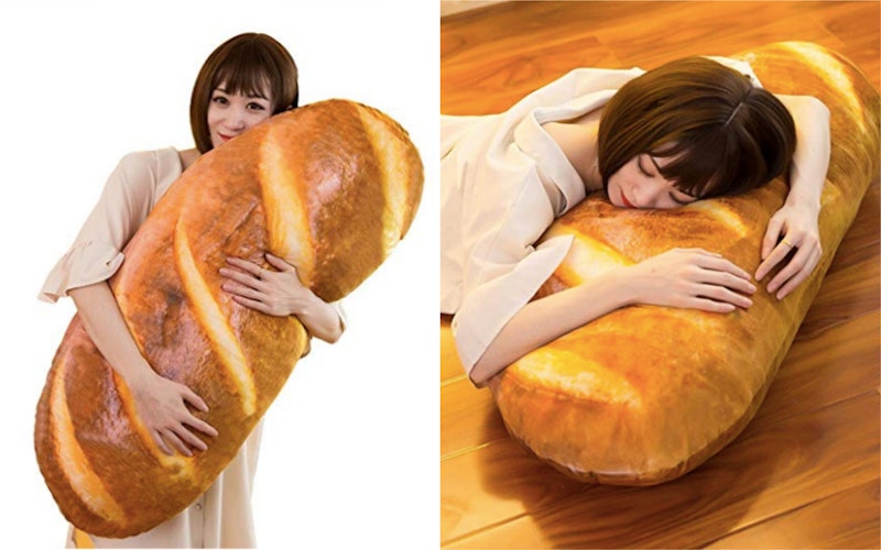 This pillow looks exactly like a loaf of bread and we need it