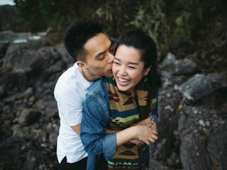 A young couple hugging, as they're helping each other out while coping with stress