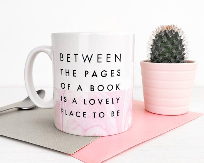 "Between The Pages Of A Book Is A Lovely Place To Be" Mug