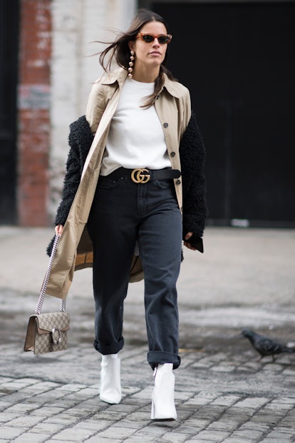Black pants outfit embellished with the Gucci logo belt