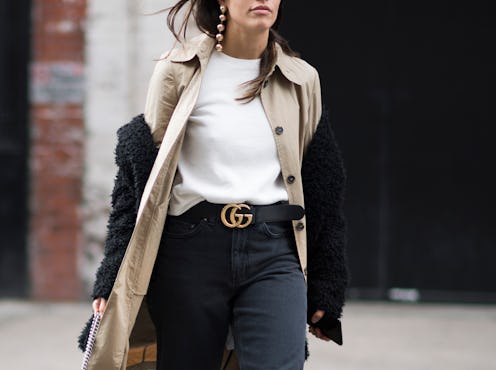 Woman wearing an outfit with the Gucci logo belt