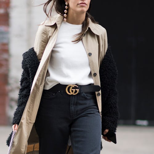 Woman wearing an outfit with the Gucci logo belt