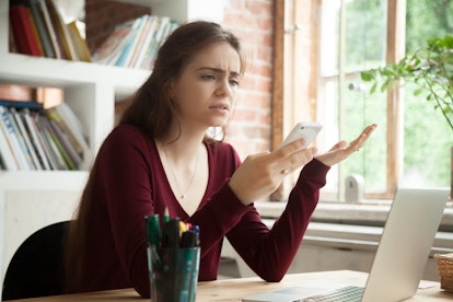 Woman stressed about TikTok viewing privacy.