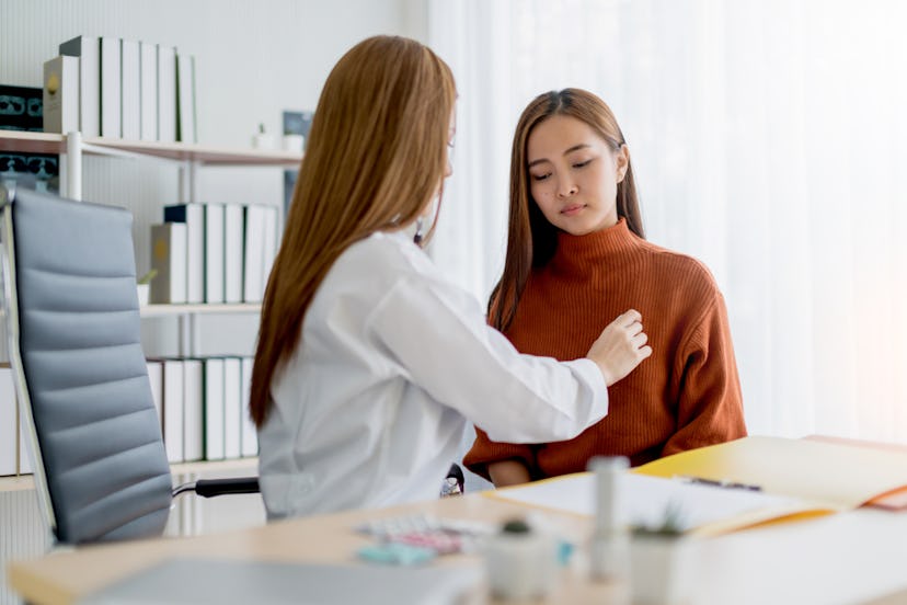 A woman with lyme disease sitting next to her doctor