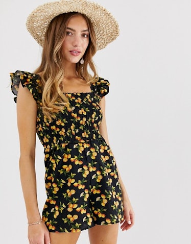 ASOS DESIGN shirred romper with frill sleeve in fruit print