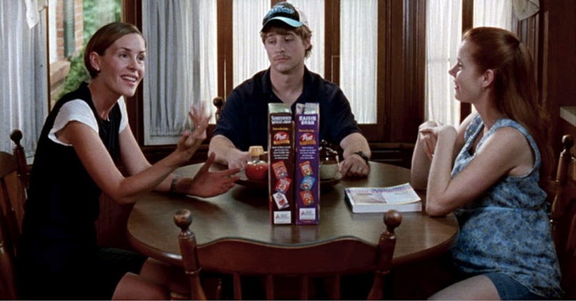 Screenshot from the Junebug romantic comedy showing Amy Adams, Ben McKenzie and Embeth Davidtz sitti...