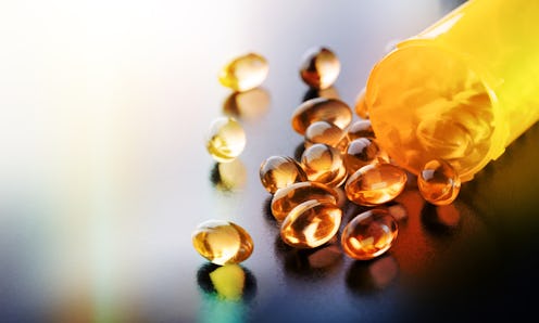 Pills with CBD scattered on a table