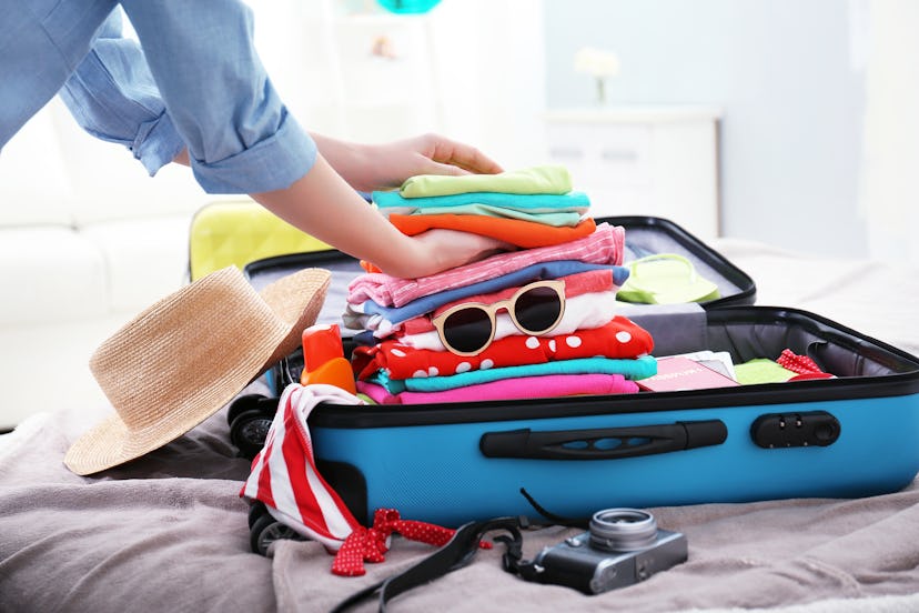 A woman packing twice before removing half of items
