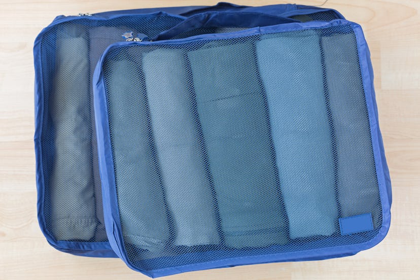 Packing cubes can help you pack light when it is winter.