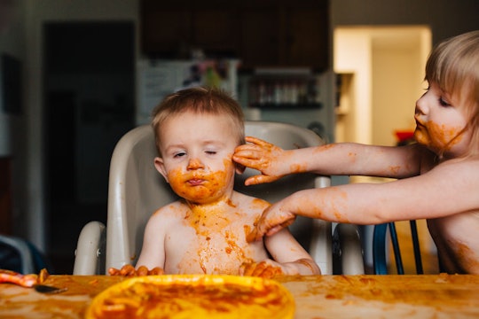 kids eating spaghetti and making a mess