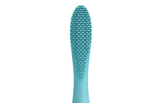 A blue silicone toothbrush on white background
