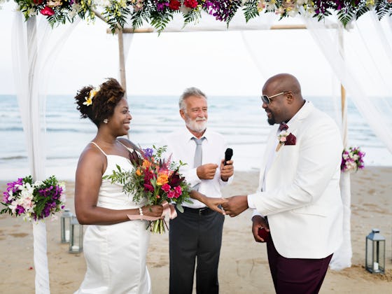A couple getting married at the beach