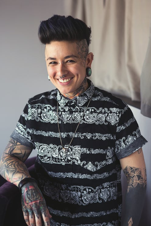 Emi Nijiya, a talented tattoo artist based in Minneapolis smiling for a photo