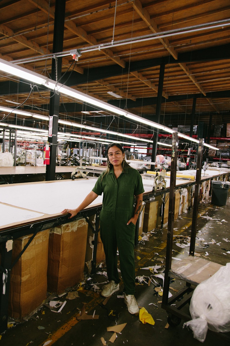 Isadora Alvarez, the founder of BackBeatRags in a clothing factory