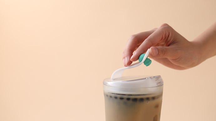 A woman closing the reusable bubble tea cup that was designed to eliminate single-use plastic