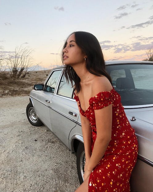 Jordan Santos, an influencer, content creator, and brand consultant posing in a red floral-patterned...