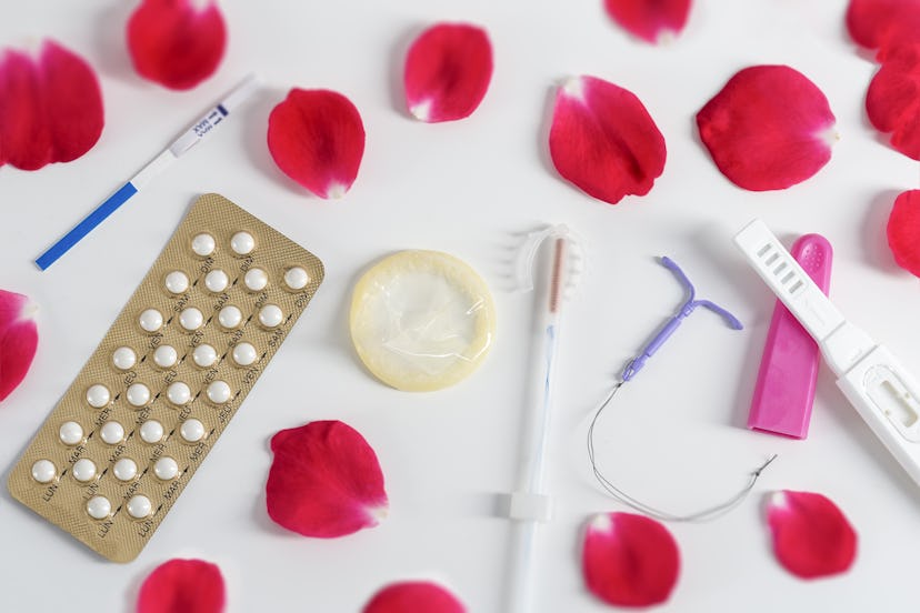 A table full of condoms, IUDS, birth control pills, and baby tests