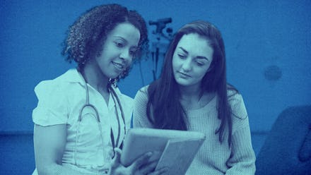 A woman talking with her doctor about getting an IUD