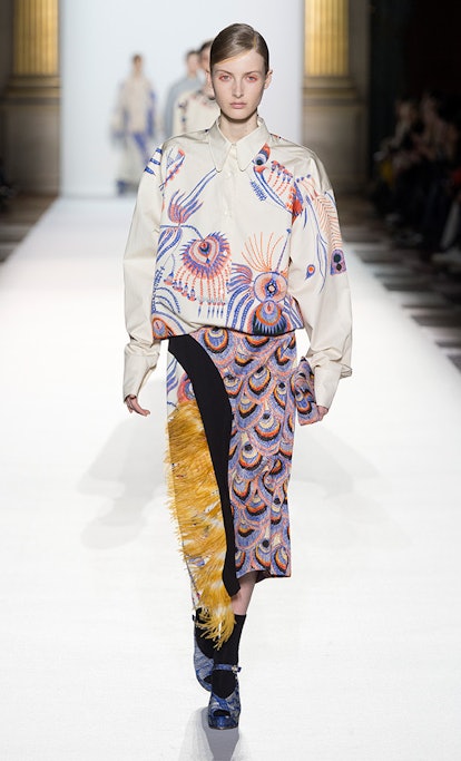 A model wears a Dries Van Noten thick jacquard peacock-feather print skirt.