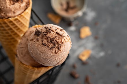 Two CBD-infused chocolate ice-cream cones, with chocolate sprinkles on top