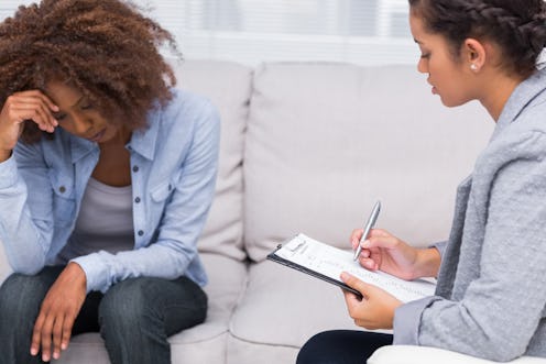 A woman testing for Lyme disease looking worried while talking to a doctor