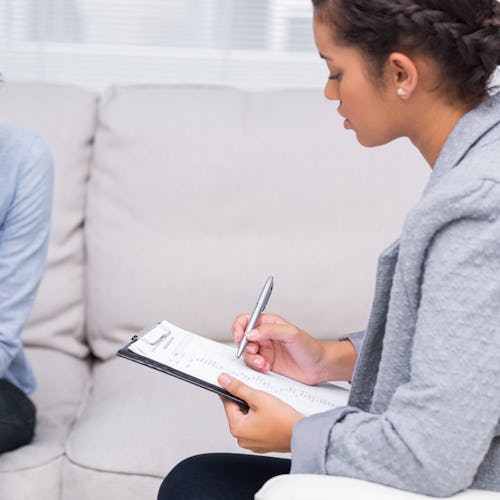 A woman testing for Lyme disease looking worried while talking to a doctor