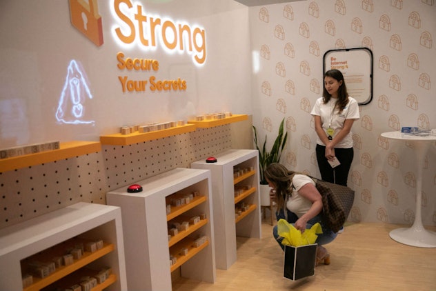 Two mothers walking along a display explaining whether a password is secure or not 