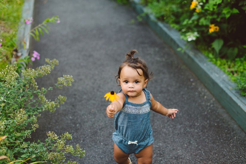 baby exploring a garden