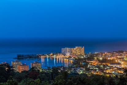 Ocho Rios, Jamaica and its wonderful sunset with a lot of interest buildings next to the beach