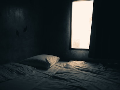 An empty bed illuminated by a window, as in the scary story "Aren't you glad you didn't turn on the ...