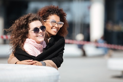 A couple who met on a dating app embracing.