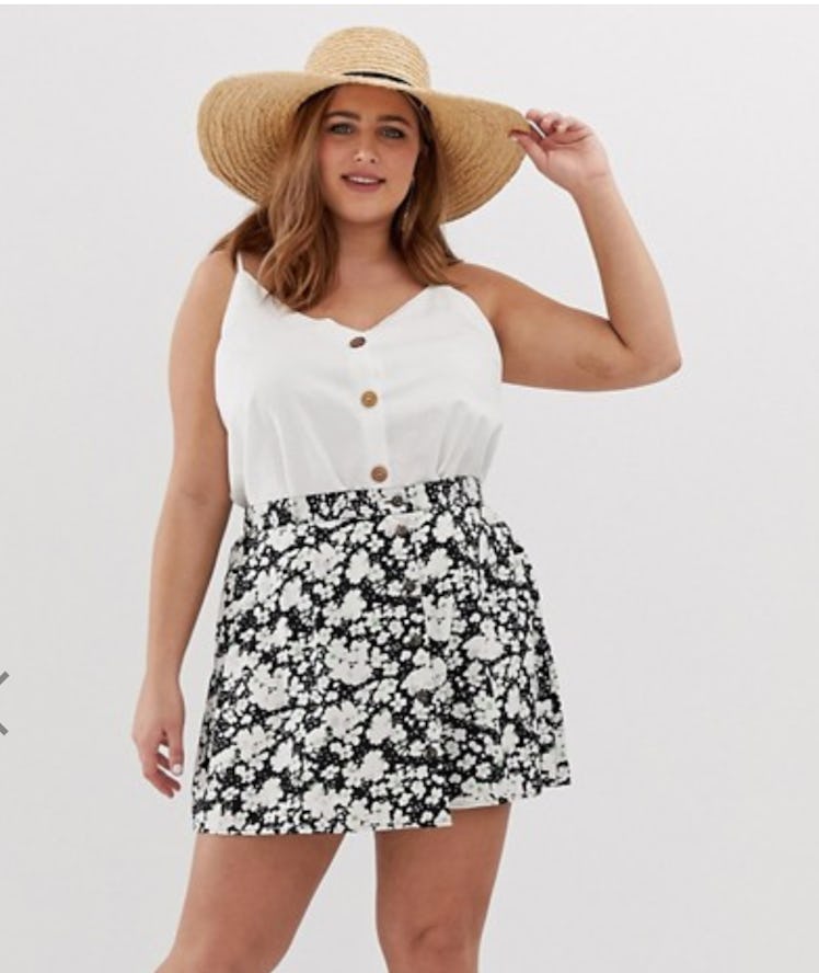 ASOS DESIGN Curve Button Front Mini Skirt in Smudged Daisy Print