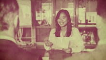 A young lady sitting on a job interview and holding her cover letter