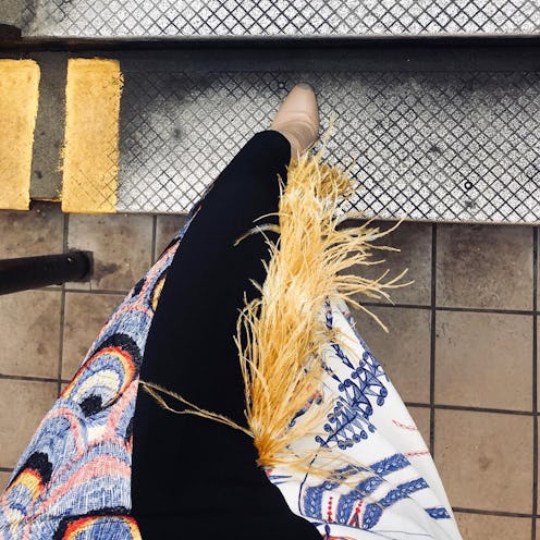 A woman wearing a Dries Van Noten skirt