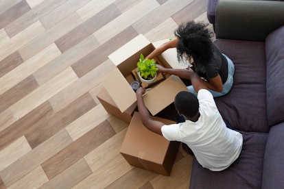 A man and a woman packing their stuff before moving