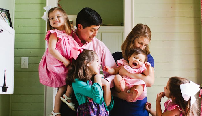 A mom and dad with their four daughters feeling isolated and judged