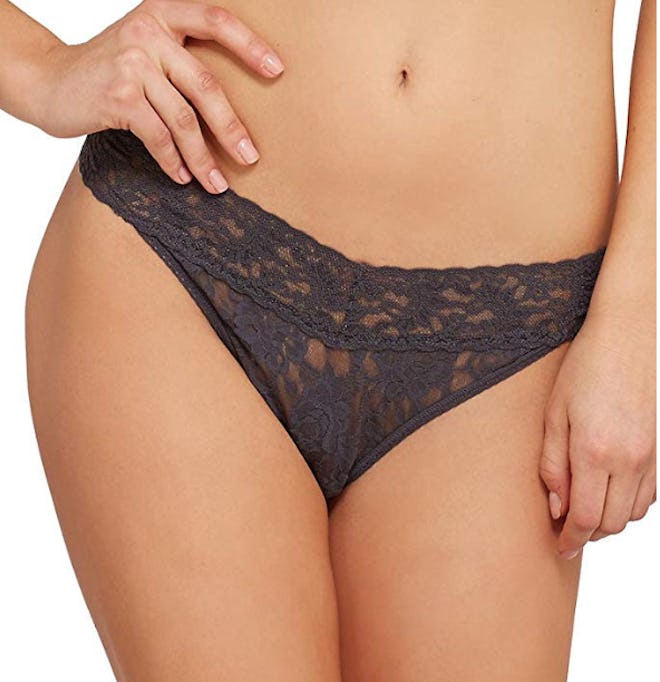 This sheer thong is made with a blend of lace, nylon, and spandex for stylish comfort.