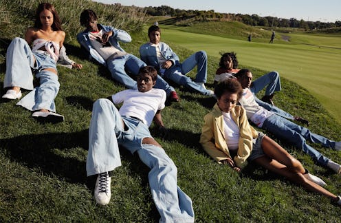 Group of models posing on a hill while wearing gender-neutral denim clothes for the Telfar Campaign