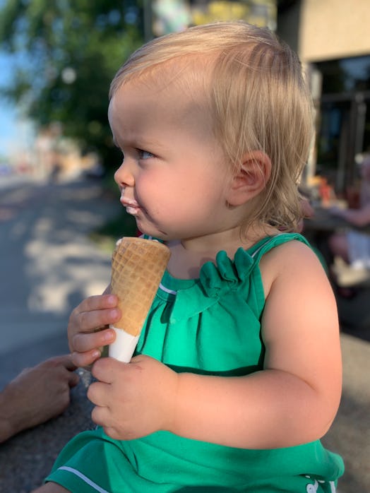 Toddler eating an ice cream cone