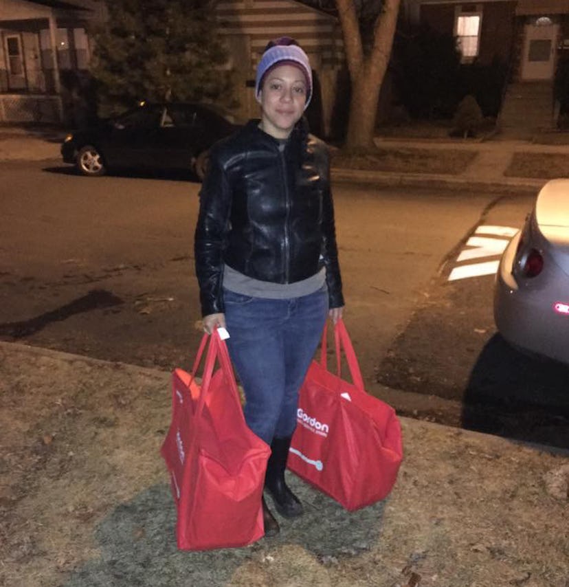 Melissa Hernandez carrying bags of supplies to deliver to her "regulars" in Chicago