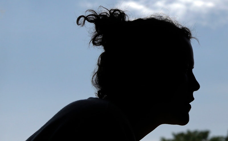 A side contre-jour portrait of a woman in a silhouette 