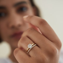 A woman posing with an engagement ring