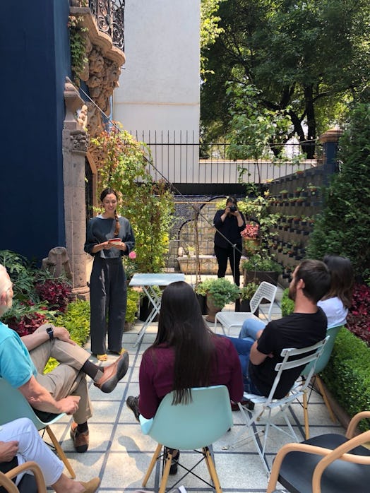 Adriene Mishler speaking to a group about yoga