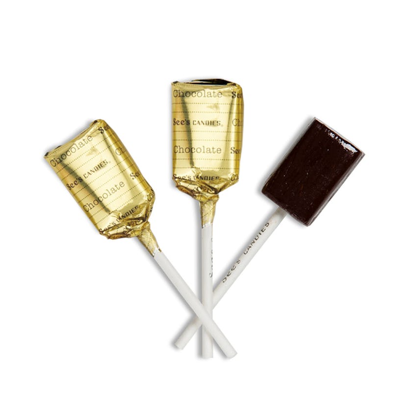 Two wrapped and one unwrapped See's Candies Lollipops