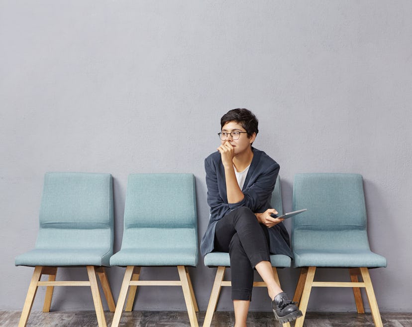 A girl sitting on a chair while waiting for doctor's appointment