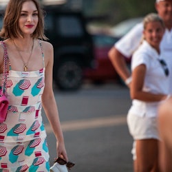 A girl wearing a colorful summer party outfit for Chanel's J12 Soiree