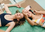 Young woman taking a selfie with her sister to post uses funny birthday wishes for sister on Instagr...