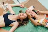 Young woman taking a selfie with her sister to post uses funny birthday wishes for sister on Instagr...