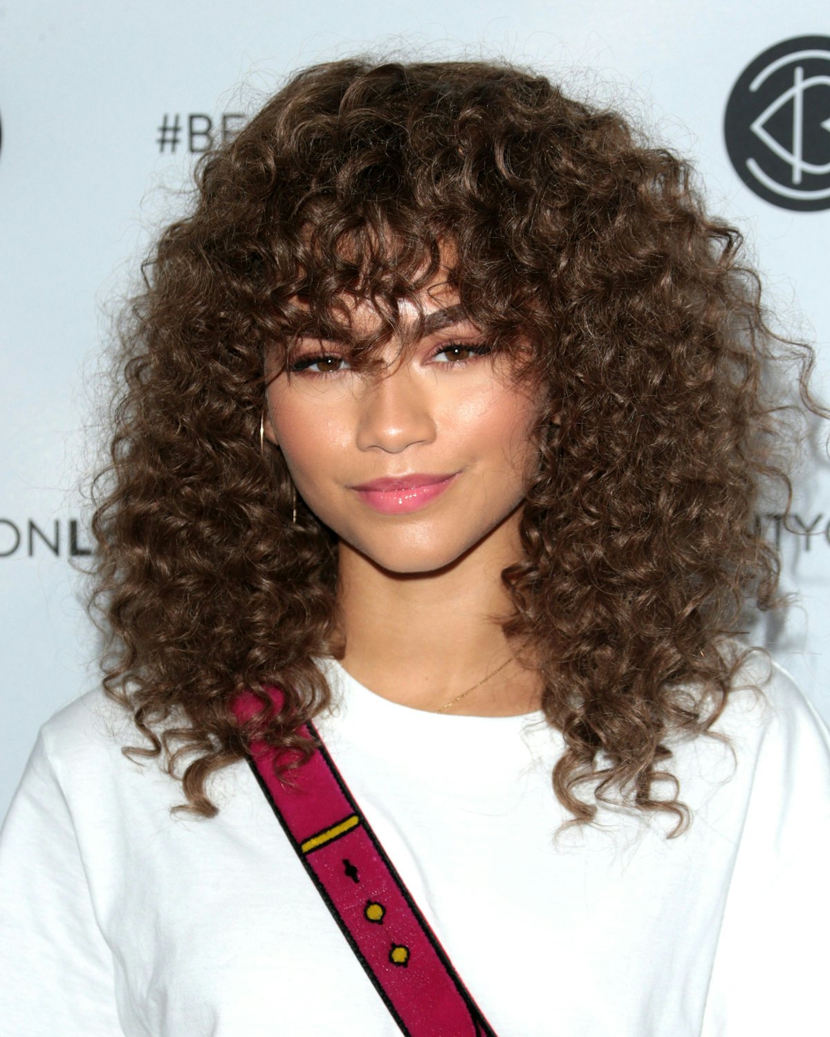 Can I Get Bangs With Curly Hair A Hairstylist Breaks Down The Best Approach For Curly Bangs