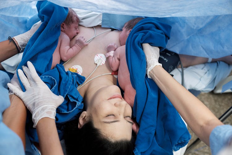 mom breastfeeding newborn twins immediately after c-section